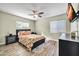 Bright bedroom with a ceiling fan and queen-size bed, hardwood flooring included at 945 E Missouri Ave, Phoenix, AZ 85014