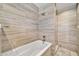 Modern bathroom with a soaking tub and walk-in shower, featuring stylish tile at 945 E Missouri Ave, Phoenix, AZ 85014