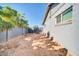 Side yard with gravel pathway and block wall at 945 E Missouri Ave, Phoenix, AZ 85014