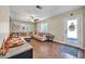 Bright living room featuring a comfortable sectional sofa and wood-look floors at 945 E Missouri Ave, Phoenix, AZ 85014