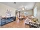 Comfortable living room with hardwood floors, L-shaped sofa, and fireplace at 945 E Missouri Ave, Phoenix, AZ 85014