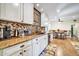 Modern kitchen with granite countertops and white cabinets at 945 E Missouri Ave, Phoenix, AZ 85014