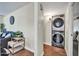 Convenient laundry room with stacked washer and dryer, located in the home at 945 E Missouri Ave, Phoenix, AZ 85014