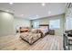 Large bedroom with ample closet space and wood-look floors at 945 E Missouri Ave, Phoenix, AZ 85014