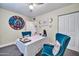 Charming office space with two chairs and a table, featuring unique wall art at 945 E Missouri Ave, Phoenix, AZ 85014