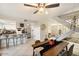 Open concept dining area with adjacent kitchen and staircase at 5883 E Thomas Rd, Scottsdale, AZ 85251