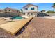 Inviting pool area with a wooden deck and landscaping at 5403 N 104Th Ave, Glendale, AZ 85307