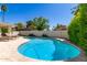 Inviting kidney-shaped pool with surrounding stone patio at 935 E Morningstar Ln, Tempe, AZ 85283