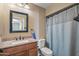 Well-lit bathroom with granite vanity and shower/tub combo at 11451 N 103Rd Ave, Sun City, AZ 85351