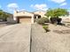 Single-story home with a two-car garage and landscaped yard at 7916 S 52Nd Ave, Laveen, AZ 85339