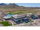 Aerial view of community clubhouse, pool, and golf course at 26404 W Zachary Dr, Buckeye, AZ 85396