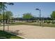 Beach volleyball court with surrounding landscaping at 26404 W Zachary Dr, Buckeye, AZ 85396