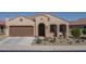 Single-story home with a two-car garage and desert landscaping at 26404 W Zachary Dr, Buckeye, AZ 85396