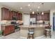 Kitchen with an island, stainless steel appliances, and granite countertops at 26404 W Zachary Dr, Buckeye, AZ 85396