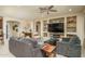 Open living room with built-in shelving and comfortable seating at 26404 W Zachary Dr, Buckeye, AZ 85396