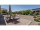 Backyard patio with table, chairs, and putting green at 26404 W Zachary Dr, Buckeye, AZ 85396