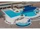 Multi-level pool area with lap lanes, spa, and lounge areas at 26404 W Zachary Dr, Buckeye, AZ 85396