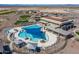 Resort-style pool with expansive sundeck and shade structures at 26404 W Zachary Dr, Buckeye, AZ 85396