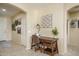 Entryway with a wooden desk and chair, wall art and decor at 26404 W Zachary Dr, Buckeye, AZ 85396