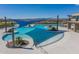 Large pool with shade structure and surrounding lounge chairs at 26404 W Zachary Dr, Buckeye, AZ 85396