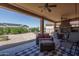 Outdoor patio area with seating, fire pit, and backyard view at 26404 W Zachary Dr, Buckeye, AZ 85396