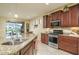 Kitchen with island, stainless steel appliances and granite countertops at 26404 W Zachary Dr, Buckeye, AZ 85396