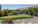 Landscaped backyard with putting green and sitting area at 26404 W Zachary Dr, Buckeye, AZ 85396