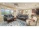 Spacious living room with gray sofas and a coffee table at 26404 W Zachary Dr, Buckeye, AZ 85396