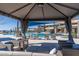 Covered seating area overlooking the pool and community amenities at 26404 W Zachary Dr, Buckeye, AZ 85396