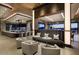 Upscale lounge with comfortable seating and a modern bar at 38440 N 95Th St, Scottsdale, AZ 85262