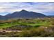 Expansive view of a desert golf course with mountains in the background at 38440 N 95Th St, Scottsdale, AZ 85262