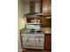 Vintage kitchen with antique stove and wood cabinets at 3614 W Krall St, Phoenix, AZ 85019