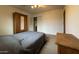 Bedroom with double bed, closet and wooden dresser at 3614 W Krall St, Phoenix, AZ 85019