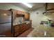 Galley style kitchen with granite countertops at 3614 W Krall St, Phoenix, AZ 85019