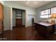 Home office with a built-in closet and hardwood floors at 3614 W Krall St, Phoenix, AZ 85019