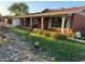 Ranch home with a covered porch and well-maintained lawn at 3614 W Krall St, Phoenix, AZ 85019