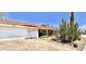 Ranch home with a large white garage door at 3614 W Krall St, Phoenix, AZ 85019
