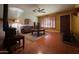 Living room with tiled floors and wood furniture at 3614 W Krall St, Phoenix, AZ 85019