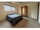 Simple bedroom with double bed, wardrobe, and carpet flooring at 3614 W Krall St, Phoenix, AZ 85019