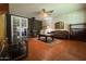 Bright living room with wood-burning stove, tiled floors, and French doors at 3614 W Krall St, Phoenix, AZ 85019