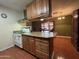 Kitchen with wood cabinets and a vintage stove at 3614 W Krall St, Phoenix, AZ 85019