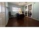 Home office with wood desk, hardwood floors and French doors at 3614 W Krall St, Phoenix, AZ 85019