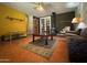 Spacious living room featuring a wood-burning stove, tiled floors, and French doors at 3614 W Krall St, Phoenix, AZ 85019