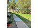 Backyard with a grassy area and a walkway at 3614 W Krall St, Phoenix, AZ 85019