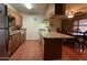 Kitchen with granite countertops and an island, plus dining area at 3614 W Krall St, Phoenix, AZ 85019