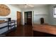 Home office with a desk, built-in shelves and closet, hardwood floors at 3614 W Krall St, Phoenix, AZ 85019