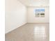 Bright living room featuring tile floors and large windows at 17548 W Madison St, Goodyear, AZ 85338