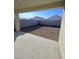 Covered patio overlooking a gravel backyard at 4936 S 105Th Dr, Tolleson, AZ 85353