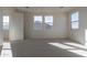 Bright and airy bedroom with neutral decor and multiple windows at 3224 W Garnet St, San Tan Valley, AZ 85144