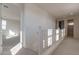 Upper hallway with white railing and carpet at 3224 W Garnet St, San Tan Valley, AZ 85144